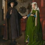 a husband and wife in green dress