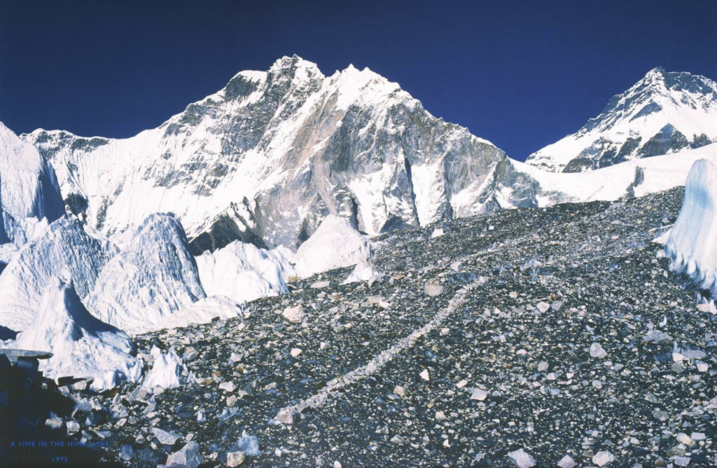 a line of white rocks in a mountainous area