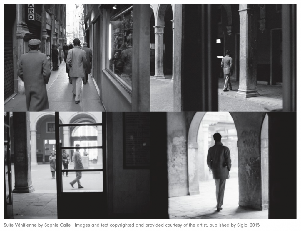 photos of a man walking away from the viewer in the city