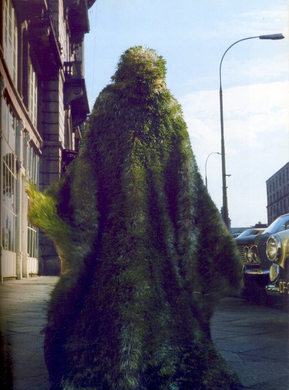woman walking in a plant coat