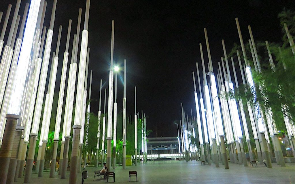 light poles in a plaza at night