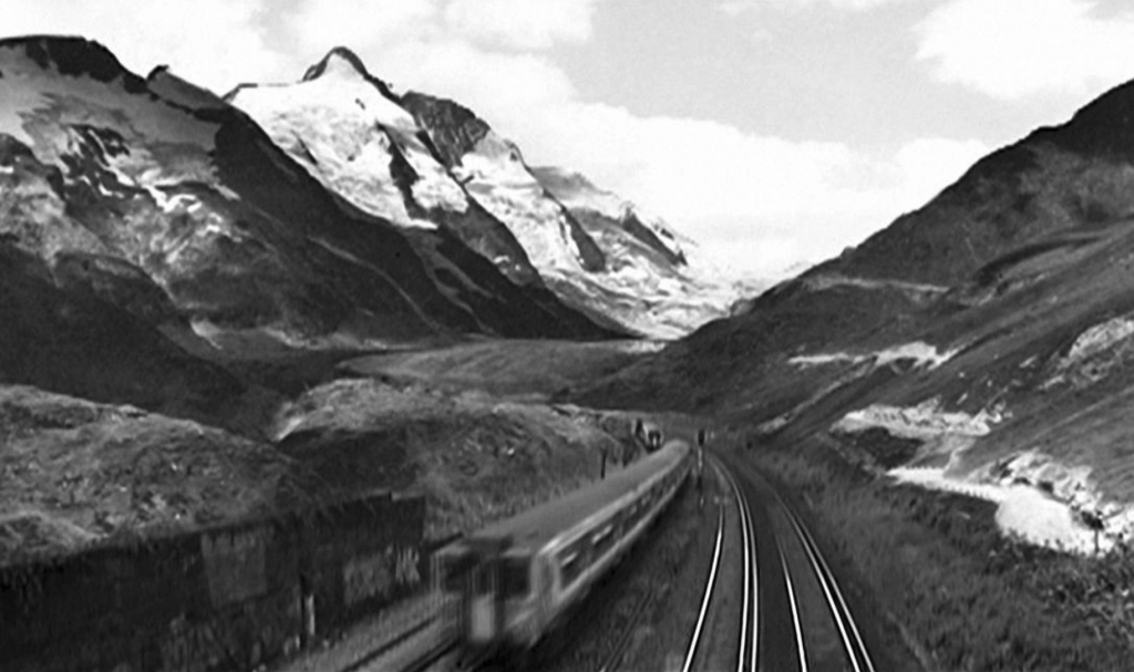 video still of road in mountains