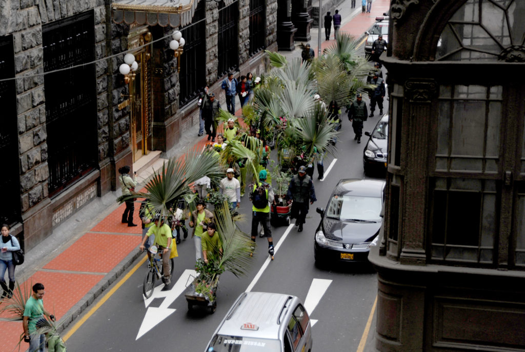 people marching with plants